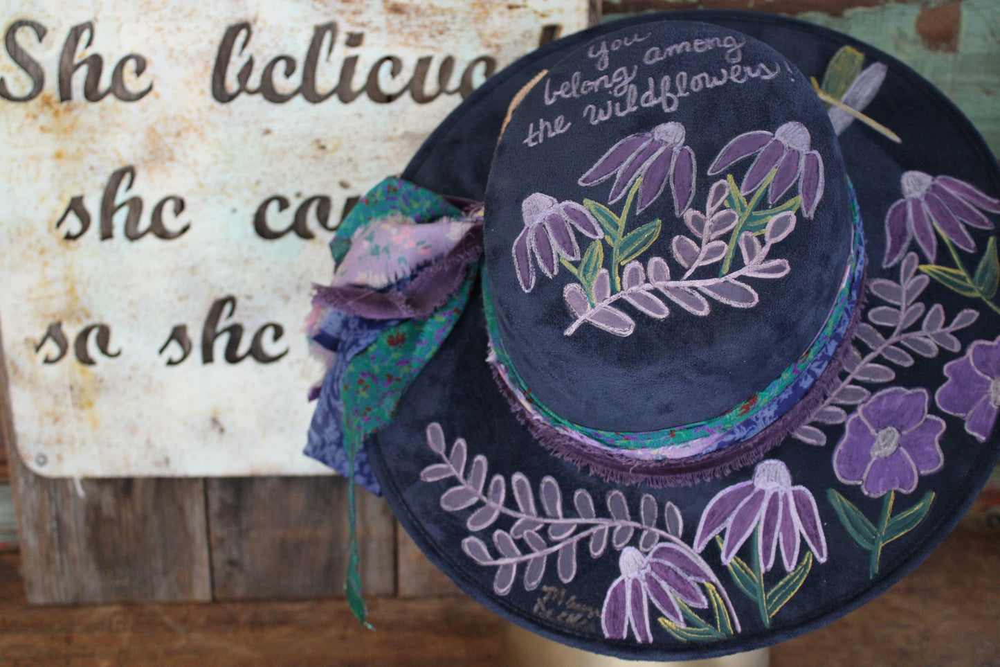 “Wildflower Melody: The Hand painted Hat with a Symphony of Style and Song”