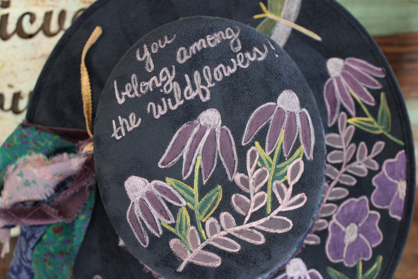 “Wildflower Melody: The Hand painted Hat with a Symphony of Style and Song”