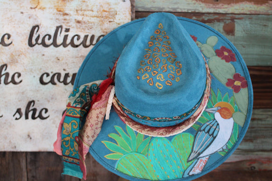 “Desert Melody: The Hand-Painted Rancher Hat with Kookaburra and Cactus”