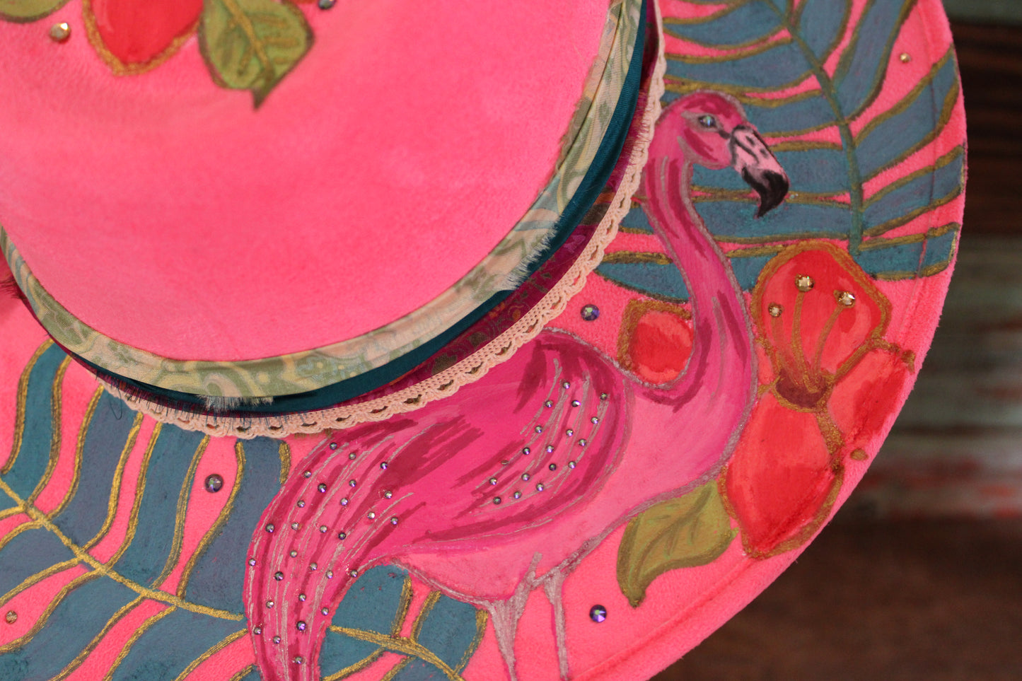 “Flamingo Fiesta: A Hand-Painted Hat with Swarovski Sparkle and Song Lyrics”