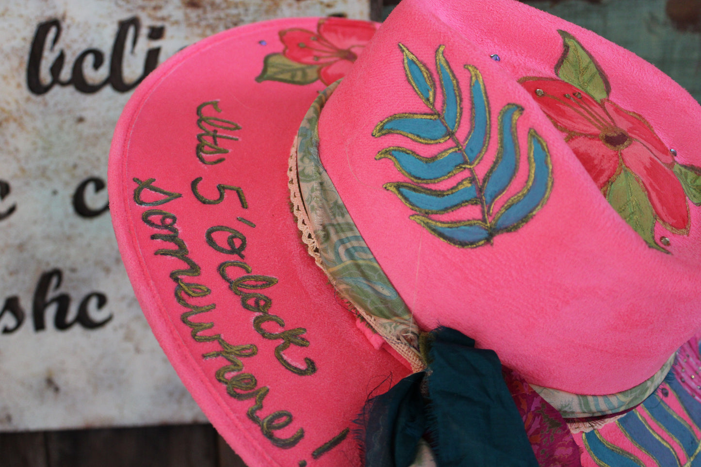 “Flamingo Fiesta: A Hand-Painted Hat with Swarovski Sparkle and Song Lyrics”